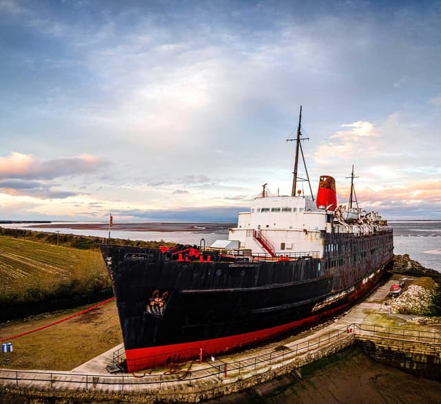 A black and red boat at Dukes Moor near W. S. Harrison in Gosforth