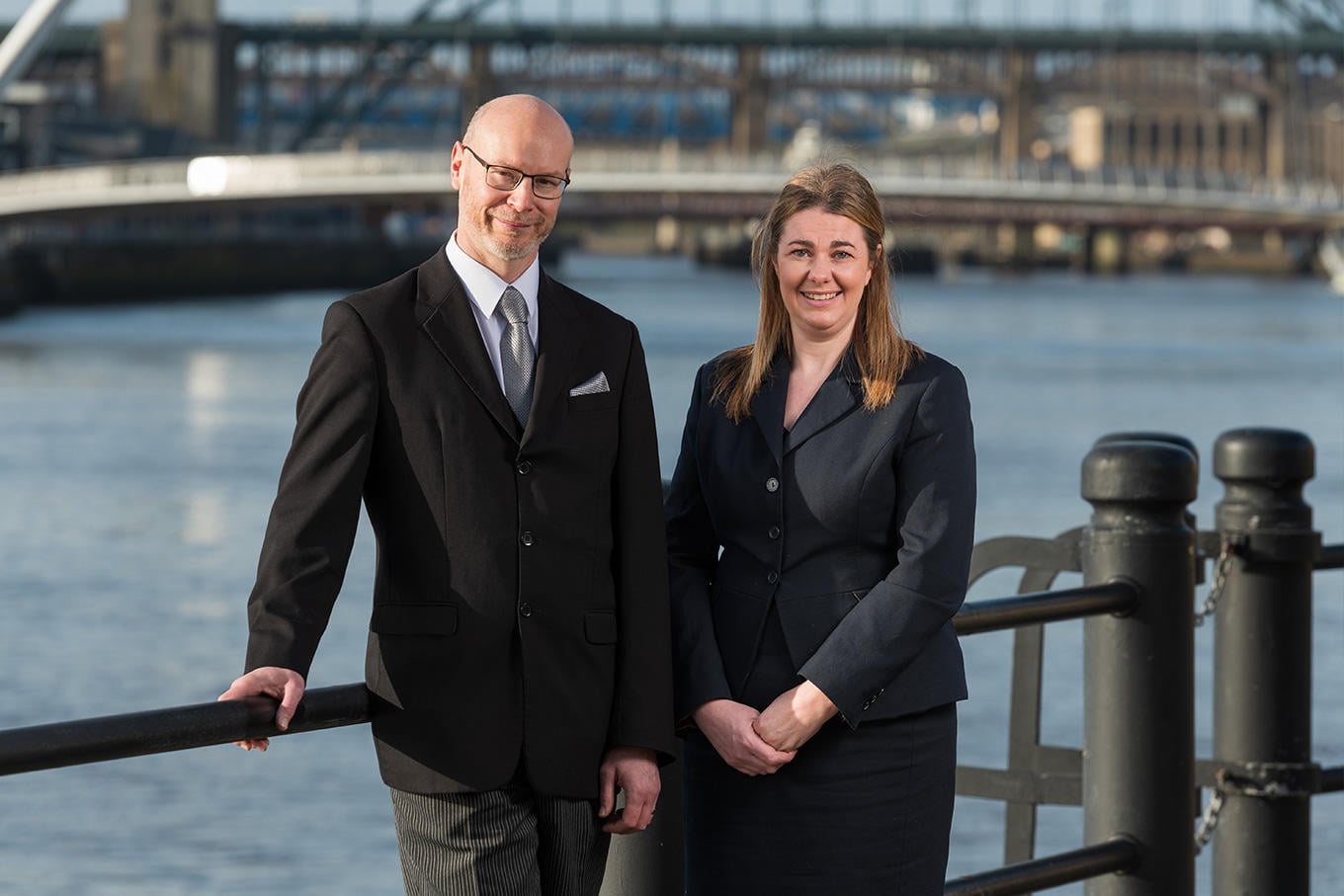 The team from WS Harrison funeral directors in Gosforth stand together wearing smart uniforms