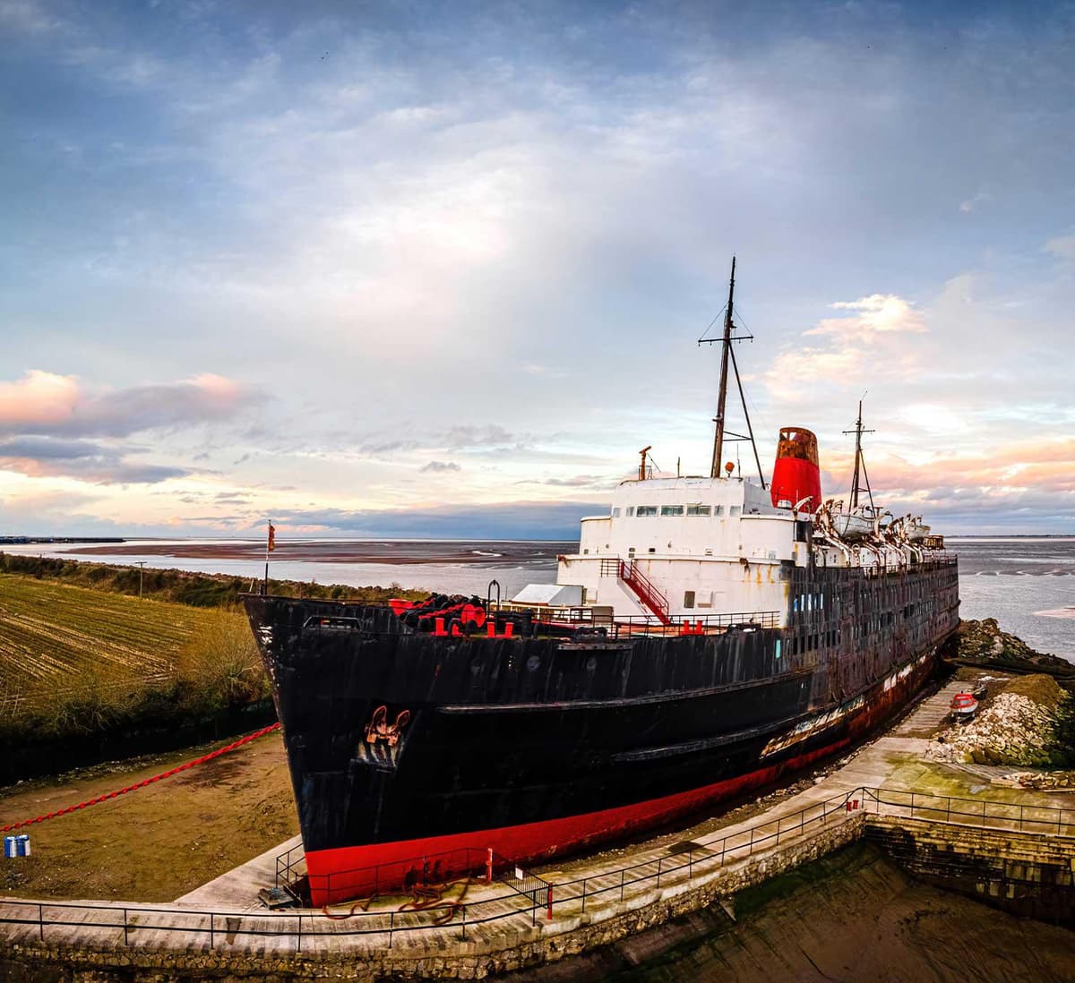 A black and red boat at Dukes Moor near W. S. Harrison in Gosforth